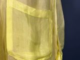 a close up of a yellow shirt on a mannequin mannequin mannequin mannequin mannequin mannequin mannequin