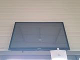 a picture of a flat screen tv mounted above a window