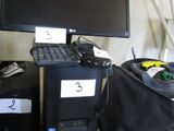 an image of a computer desk with a monitor and a keyboard