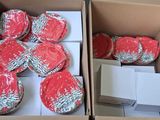 many cupcakes in a box that are wrapped in plastic