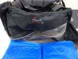 a blue bag and a black bag sitting on a table