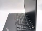 a black laptop with a black keyboard on a white surface