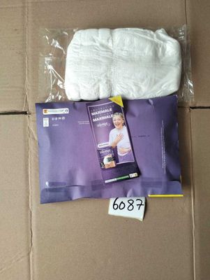 a package of diapers sitting on top of a cardboard box