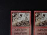 two cards that are sitting on a table
