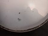 a close up of a white bowl on a table