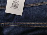 the back of a pair of jeans with a price tag on it