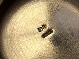 a close up of a metal plate with a logo on it