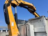 a large yellow machine that is sitting in the dirt