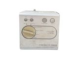 an old fashioned radio sitting on a white surface