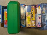 a green suitcase with a lot of different items inside of it