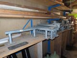 a long shelf with a bunch of pipes on it