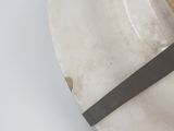 a white plate with a clock on it with a black handle