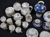 many different types of tea and coffee cups and saucers