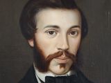 portrait of a man with a beard and a bow tie