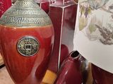 many vases that are on a table in a room