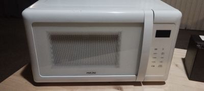a microwave that is sitting on a counter top