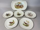 six plates with different designs of animals on them sitting on a table