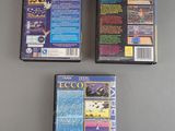 three video games are sitting on a table next to each other
