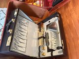 an open suitcase sitting on a table in a room