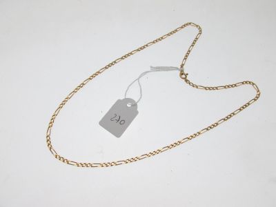 a gold chain with a price tag attached to it
