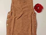an image of a sweater with buttons on it