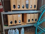 a shelf with several boxes of cleaning products on top of it