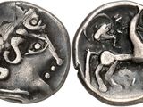 an ancient coin with a horse and rider on it