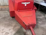 an image of a red machine that is in a garage