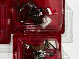 three plastic trays with horse figurines in them