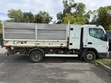a white truck that is parked in a parking lot