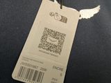 an image of a luggage tag with a qr code attached to it
