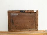 a picture of an old wooden box on a shelf