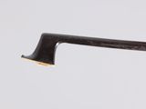 a close up of the handle of a black and gold cane