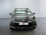 the front of a black volkswagen vw golf parked in a white room