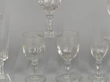 a lot of wine glasses that are sitting on a table