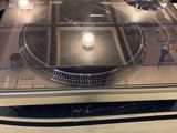 a turntable sitting on top of a table in a room