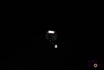 a small box in the middle of a dark room