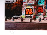 a picture of a picture of a building with graffiti all over it