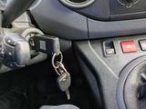 a car dashboard with a bunch of keys attached to it
