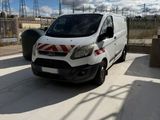 a white van that is parked on the side of the road