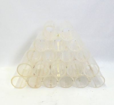 a white plastic cone with a lot of clear plastic tubes on top of it