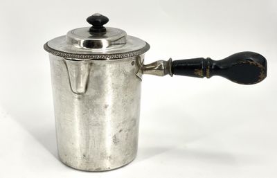 an old silver coffee pot with a wooden handle on a white background