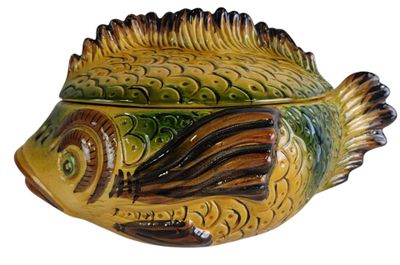 a ceramic fish shaped container on a white background