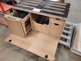 a wooden table with drawers and drawers on it
