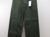 a close up of a pair of green pants hanging on a wall