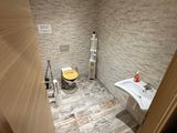 a bathroom with a toilet, sink, and bathtub in it