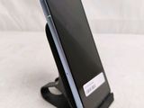 a cell phone that is sitting on a stand