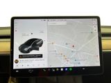 a laptop with a car on the screen on a train