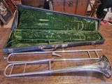 a case with a trumpet inside of it on a table
