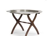 a metal tray with wooden legs and a metal tray on top